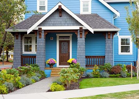 Blue Home with Homeowners Insurance in Bellevue, Council Bluffs, Omaha, Papillion, Treynor