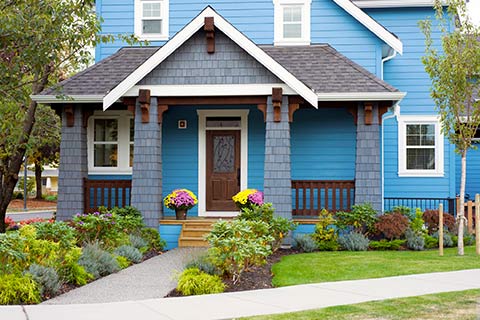 Blue Home with Home Insurance in Bellevue, Council Bluffs, Omaha, Papillion, Treynor