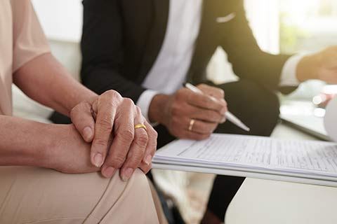 Woman and man discussing Health Insurance in Omaha, NE