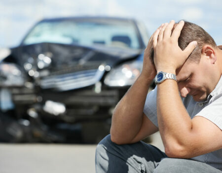 a man upset after an accident that requires Auto Insurance in Omaha, NE, Bellevue, NE, Papillion, NE, Treynor, IA, Council Bluffs, IA